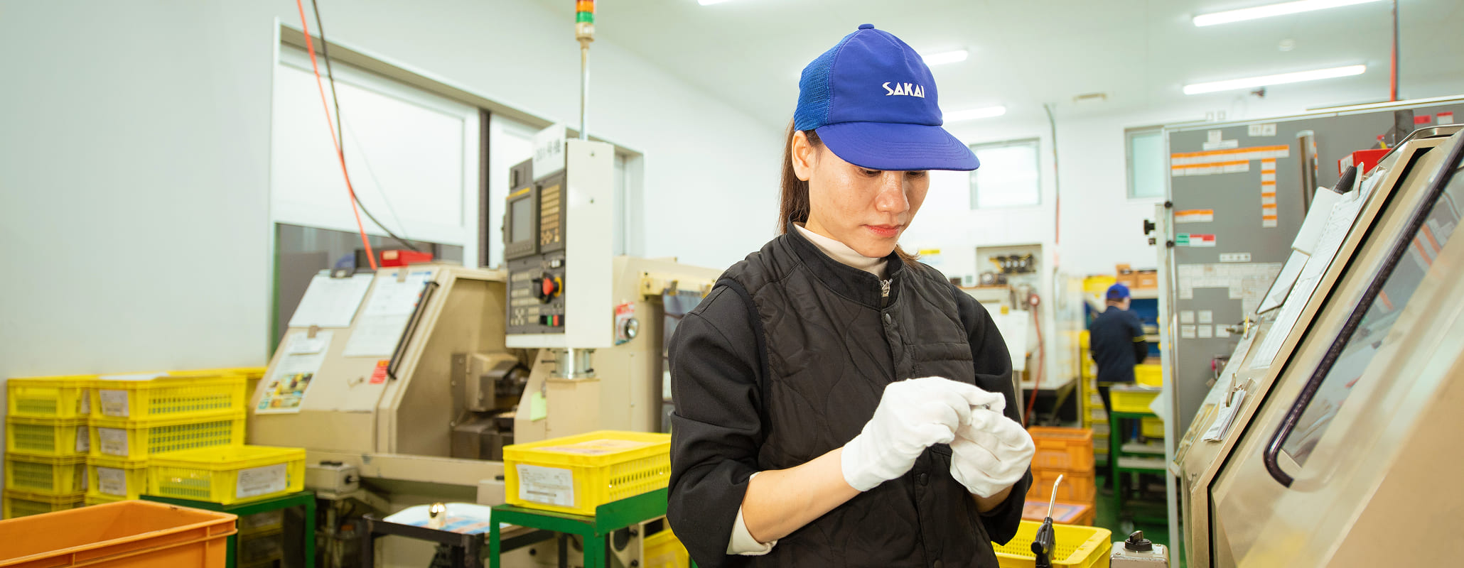 品質保証ページのメインビジュアル。株式会社坂井製作所の本社・工場の外観の写真。